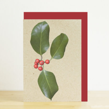 A6 greeting card featuring a photo design of holly with red berries