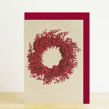A6 greeting card featuring a photo design of a red berry wreath