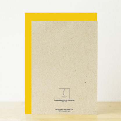 Back of greeting card featuring product text and yellow envelope